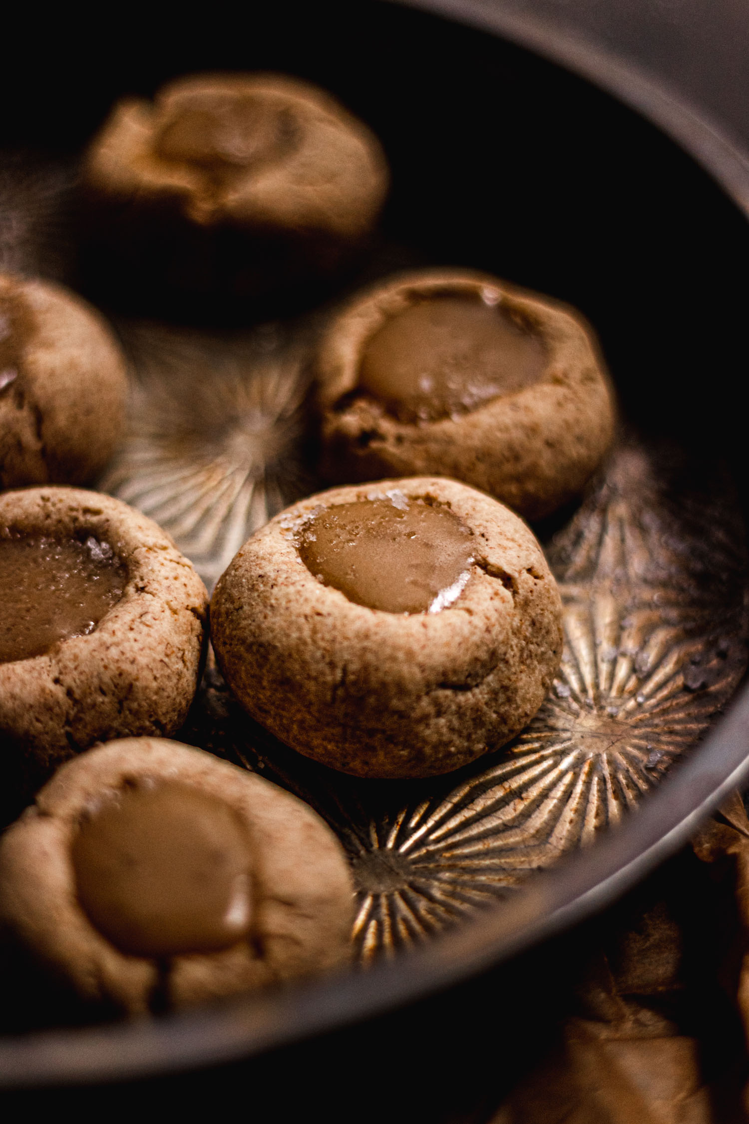 Dulce de Leche Thumbprint Cookies in a pan, ready to be eaten