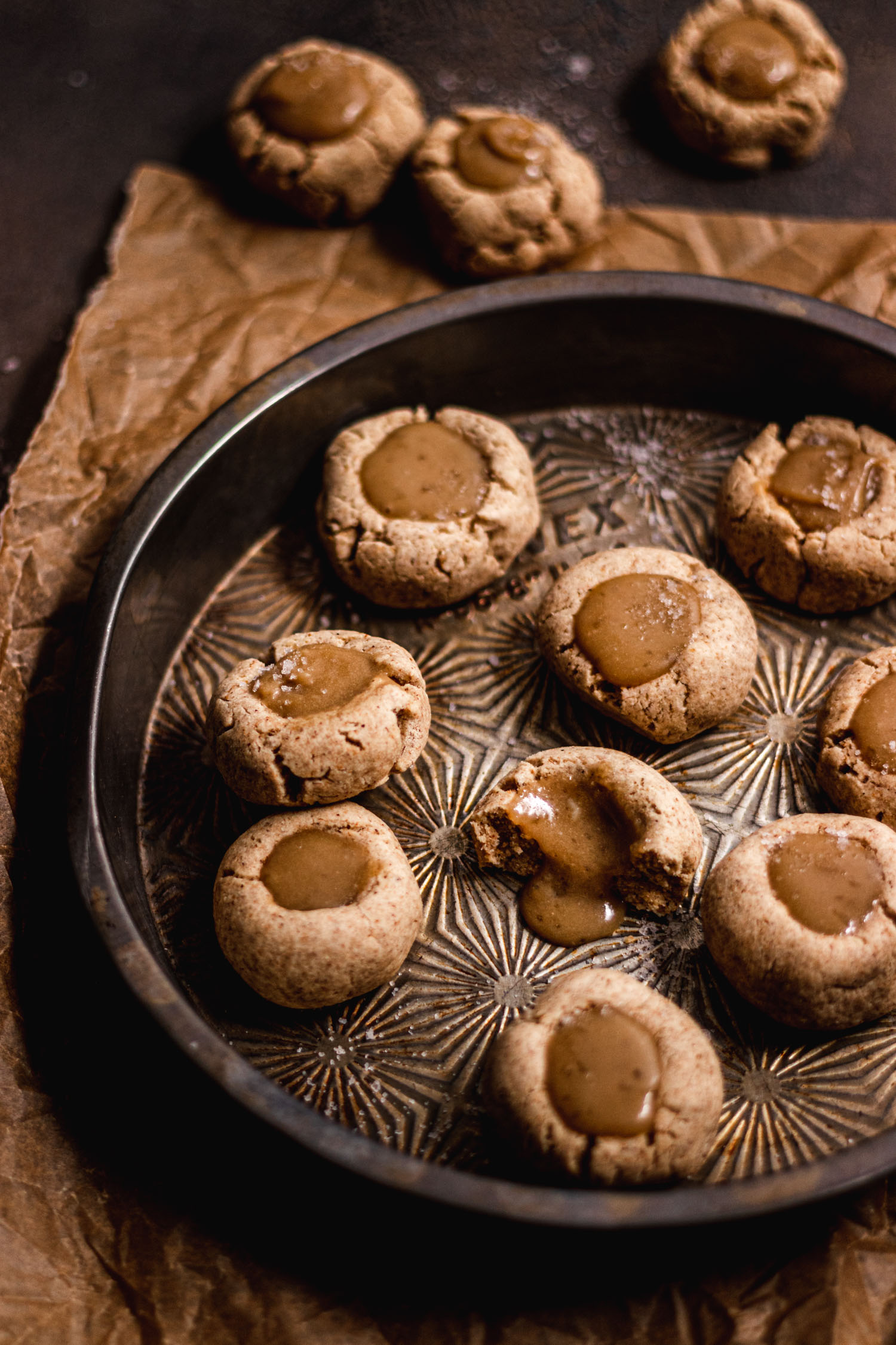 Dulce de Leche Thumbprint Cookies in a metal cake pan