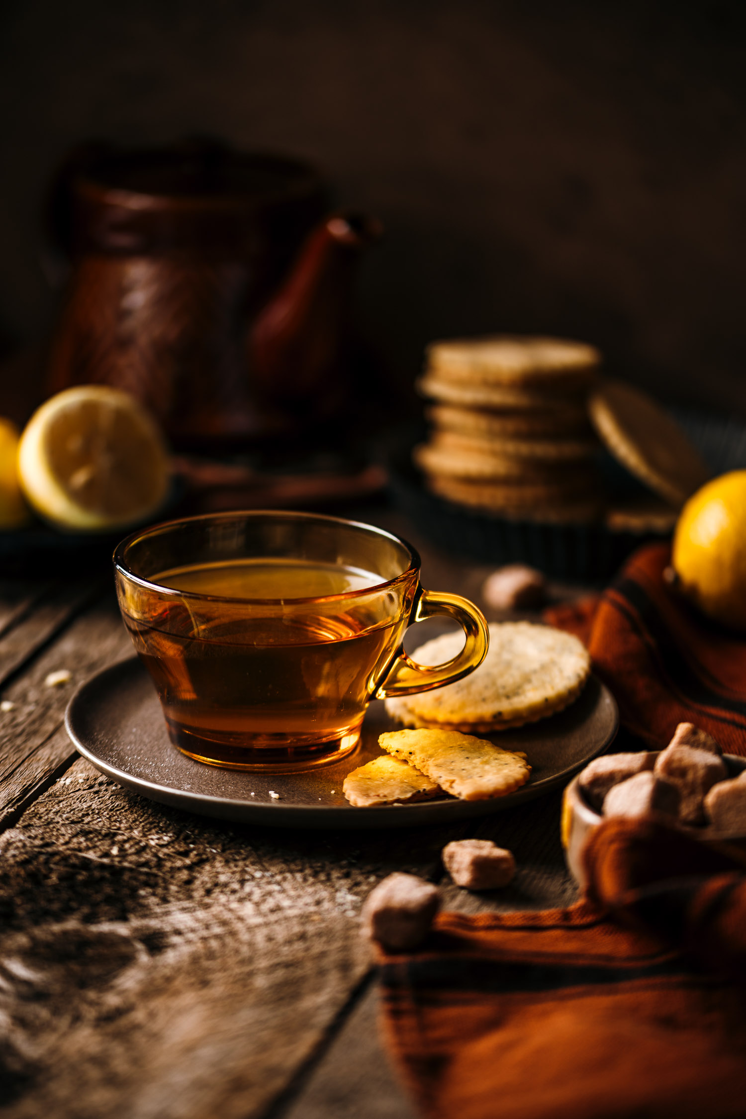 Tea mug on a plate with Lemon Poppy Seeds Shortbread Cookies