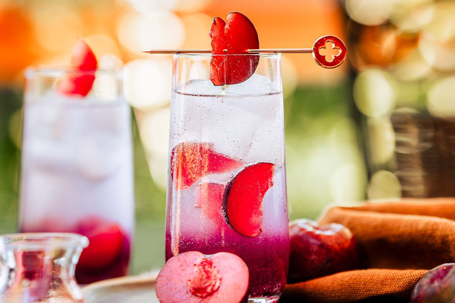 Sweet Plum and Vanilla Gin Tonic on a table outside