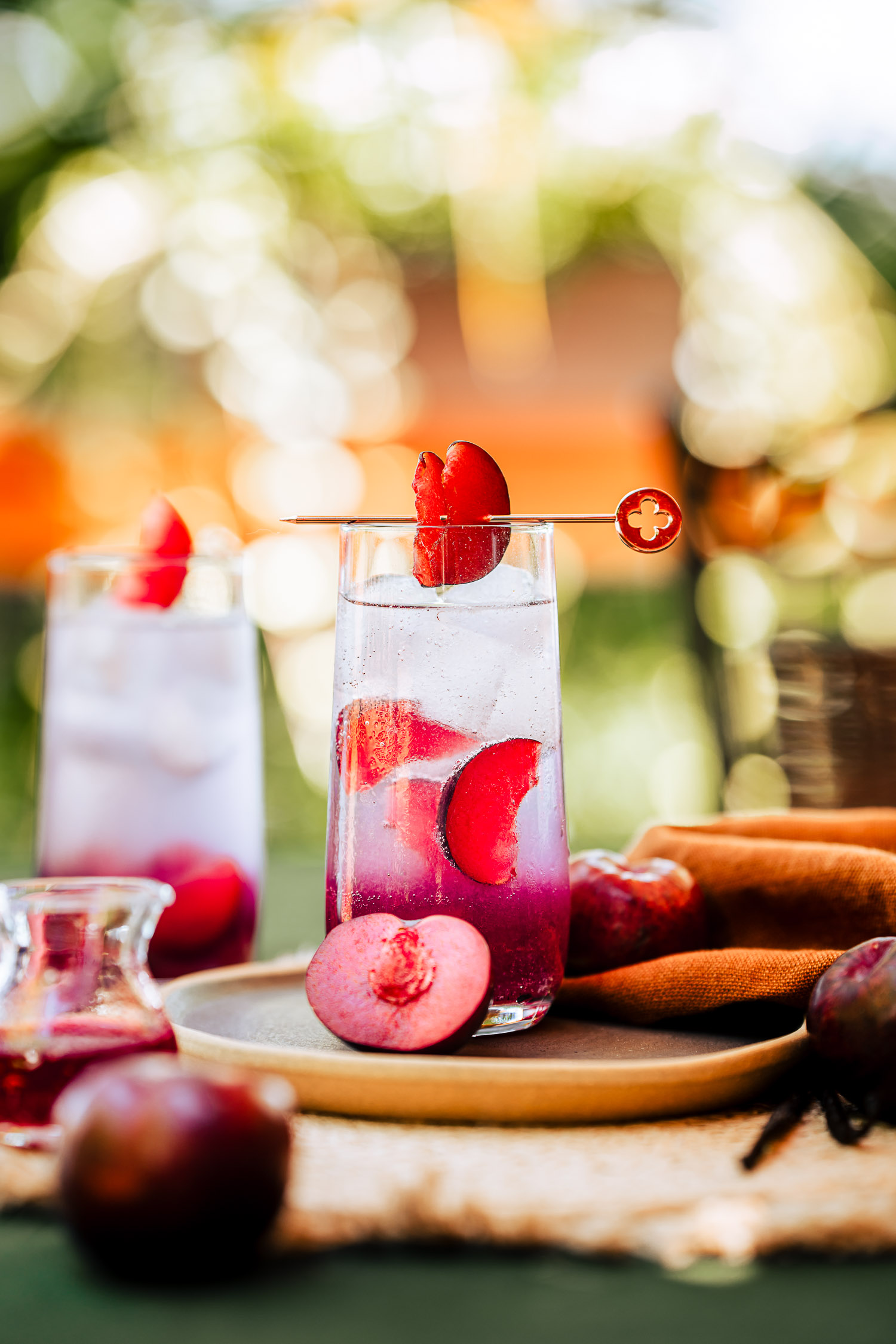 Sweet Plum and Vanilla Gin Tonic on a table outside