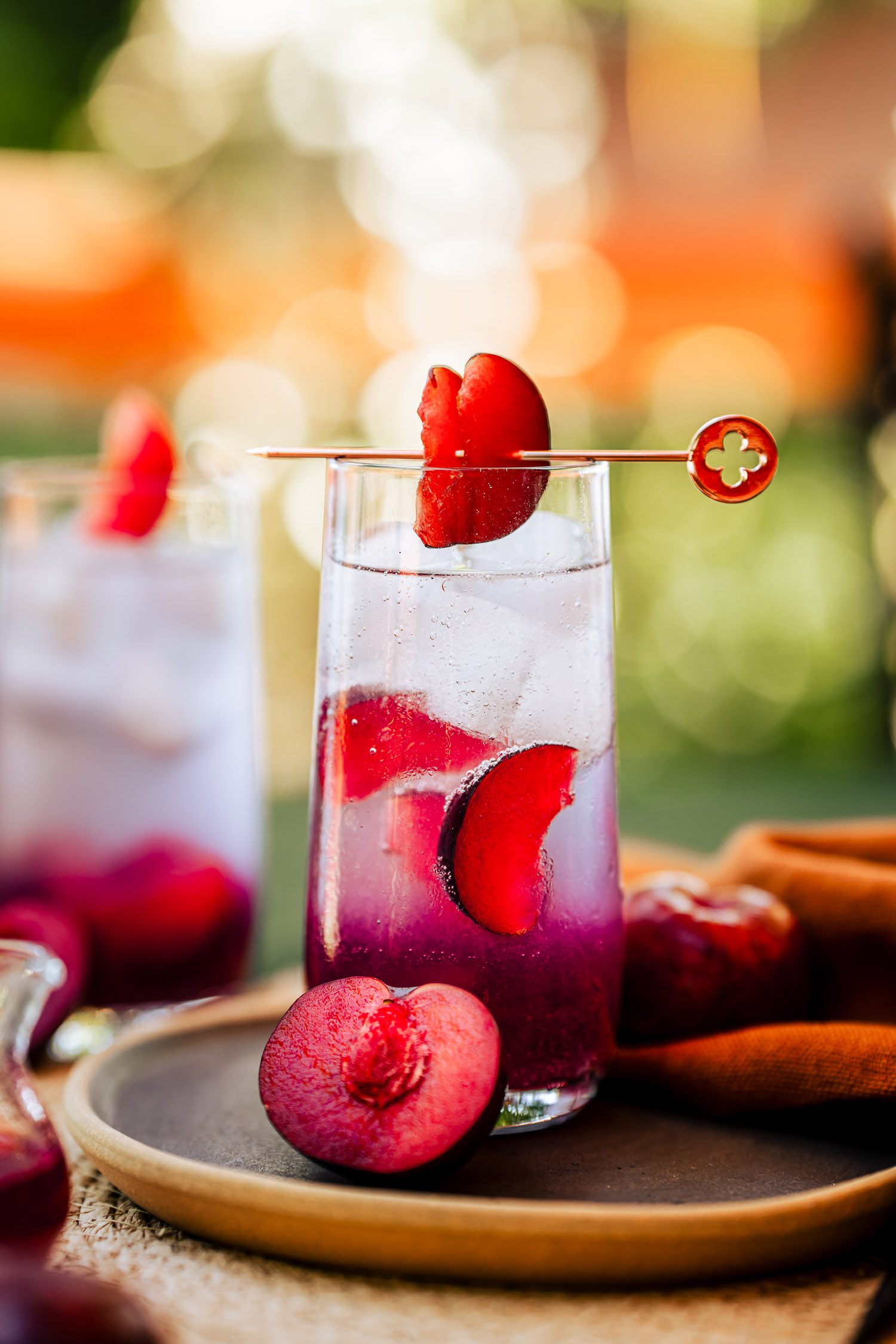 Closeup of a tall glass filled with a Sweet Plum and Vanilla Gin Tonic