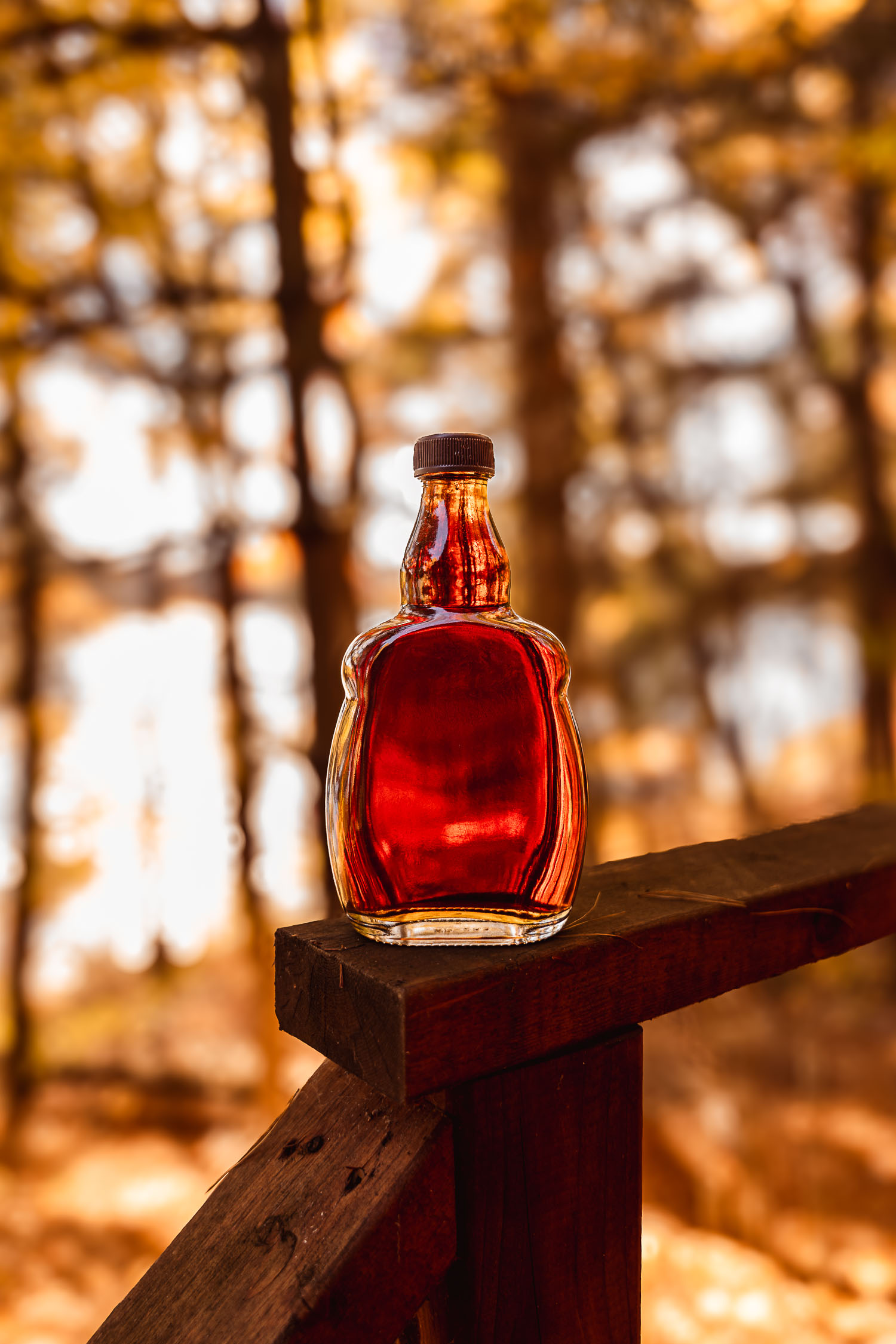 Maple syrup bottle outside in fall decor